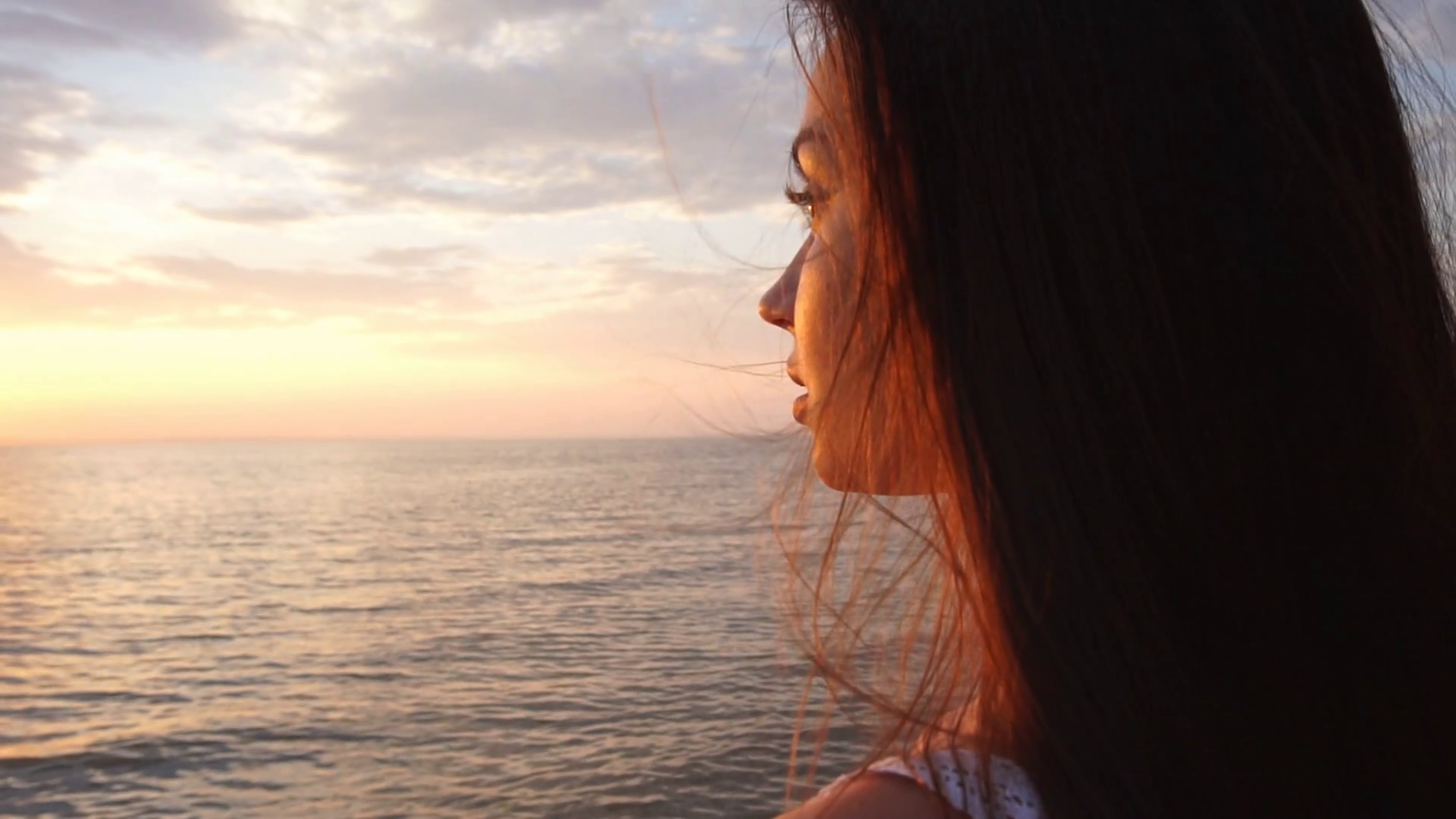 Woman watching sunrise on beach australia